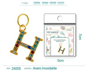 Charm de letra H de acero dorado con circonita